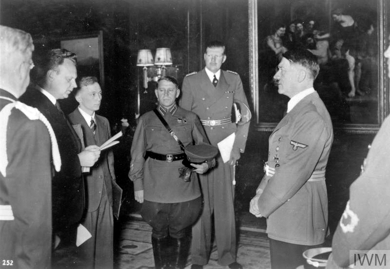 Alexander Schkwarzew, Soviet Ambassador reads his letters of accreditation to Adolf Hitler, with the Russian Military Attache, General Maksim Purkayev